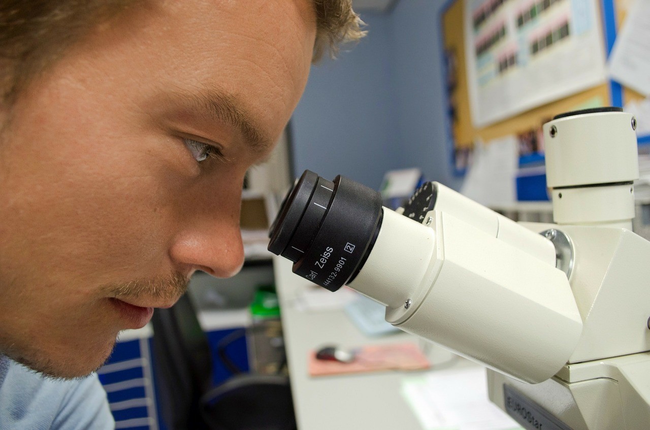 Boy looking into a microscope
